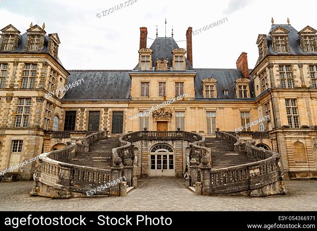 Fontainebleau, France, March 30, 2017: Royal castle of Fontainebleau. The castle is of Renaissance style, located near the downtown of Fontainebleau