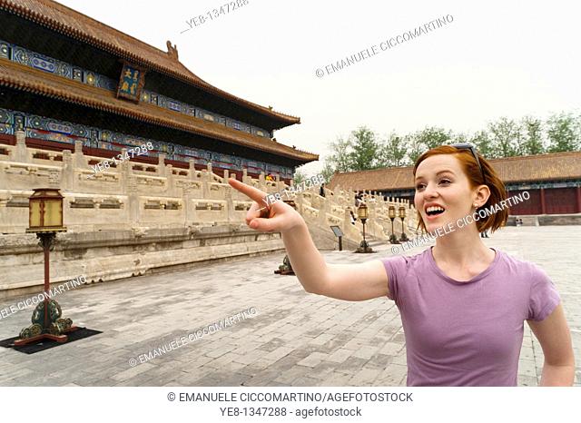 Tourist pointing something out in The Forbidden City, Beijing, China, Asia  MR