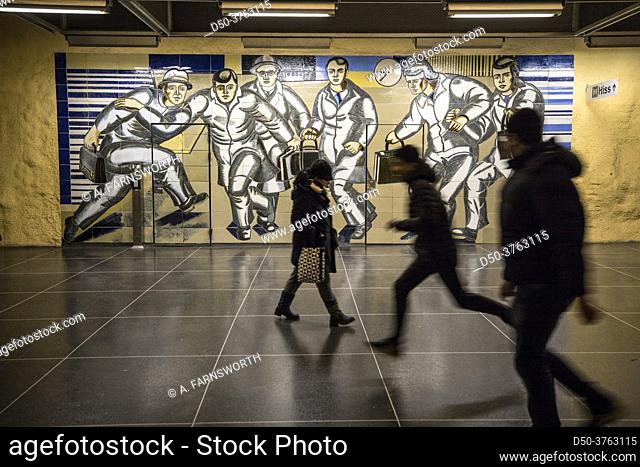 Stockholm, Sweden Passengers on the platform in the Akalla subway station in the Akalla suburb, mural designed by Birgit Ståhl-Nyberg
