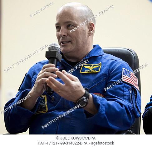 Expedition 54 flight engineer Scott Tingle of NASA answers a question during a press conference, Saturday, December 16, 2017 at the Cosmonaut Hotel in Baikonur