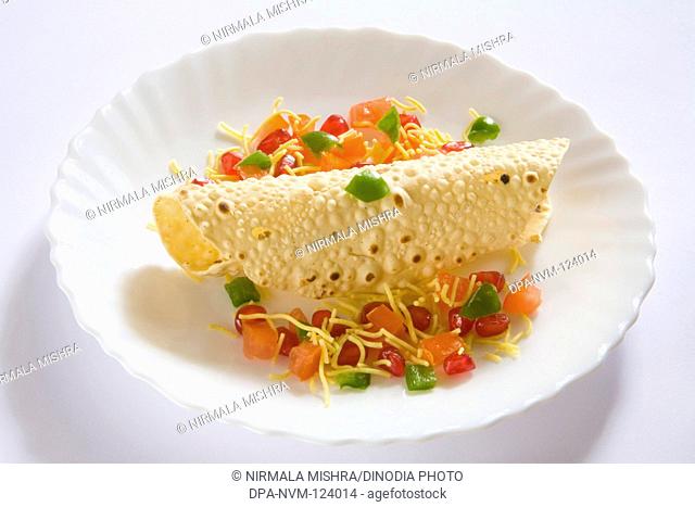 Indian Food Papad , Poppadoms are Round Wafer-thin Discs made of various Lentil or Cereal Flours Served Roasted or Deep Fried , India