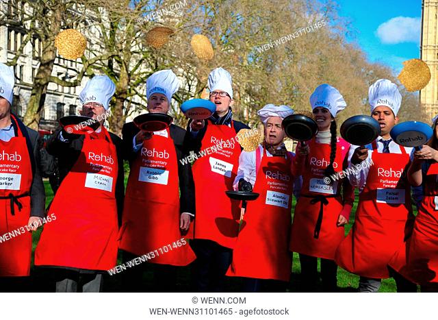 Lords, MPs and members of media teams take part in pancake race - celebrating 20 years of flipping for Rehab charity and its work with disabled people