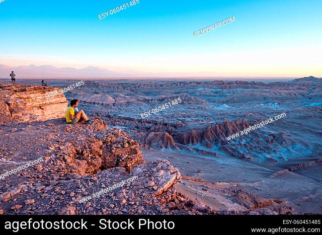 ATACAMA DESERT, CHILE - 7 DEC, 2014: Tourists make pictures in the Atacama desert, Chile. Atacama Desert proper occupies 105, 000 square kilometres