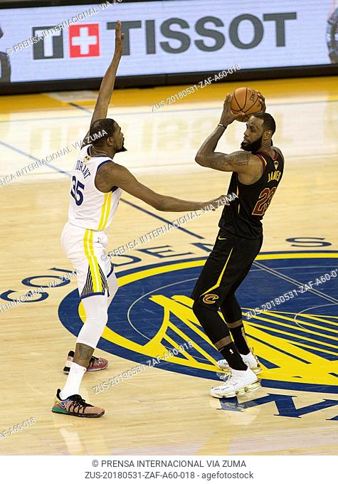 May 31, 2018 - Oakland, CALIFORNIA, UNITED STATES OF AMERICA - LeBron James #23 of the Cleveland Cavaliers drives against Kevin Durant #35 of the Golden State...