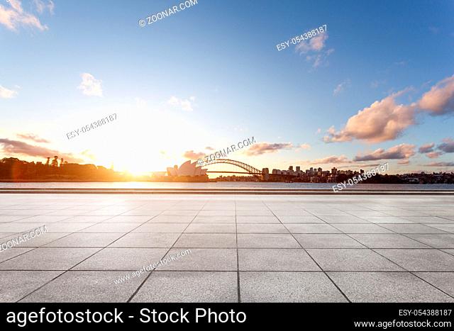 landmark sydney opera house and bridge at sunrise from empty brick floor