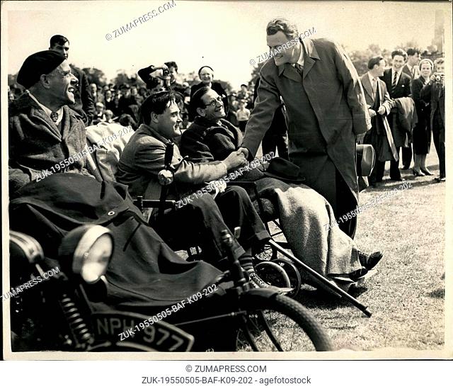 May 05, 1955 - Thousands listen to Billy Graham at Dagenham. Talking to disabled.: A crowd - many thousand strong listened to Billy Graham the American...