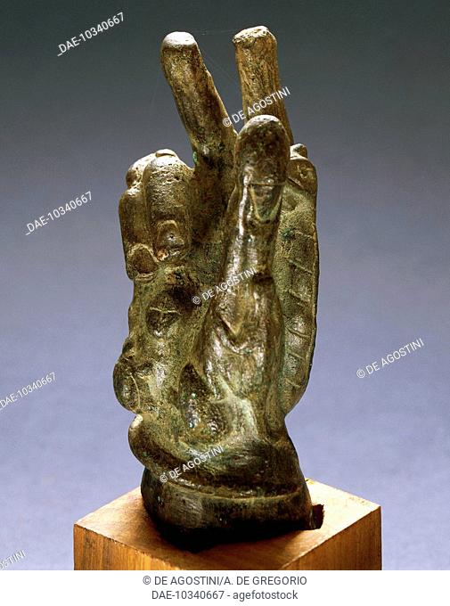 Hand-shaped bronze amulet with apotropaic symbols. Roman Civilisation.  Brescia, Museo Civico Dell'Età Romana E Tempio Capitolino (Archaeological Museum)