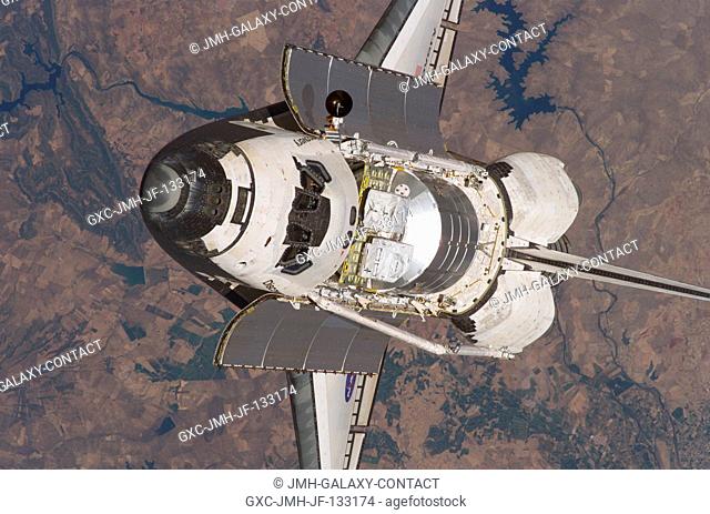 The Space Shuttle Discovery approaches the International Space Station for docking but before the link-up occurred, the orbiter posed for a thorough series of...