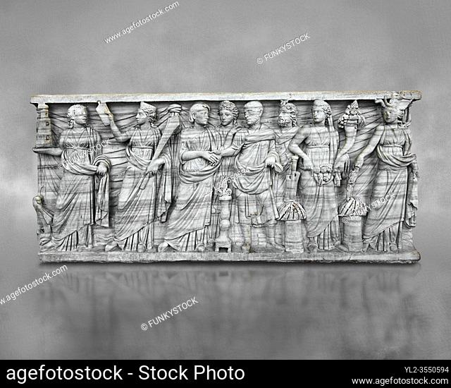 Roman relief sculpture on a sarcophagus side showing a married couple with pagan deities, circa 270 - 280 AD from the via Latina, Rome, Italy