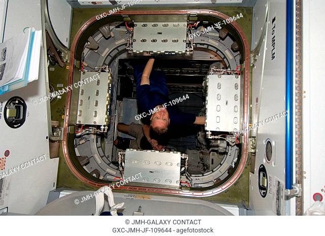 Astronaut Eric Boe, STS-126 pilot, floats near the hatchway of the multi-purpose logistics module Leonardo, temporarily docked with the International Space...