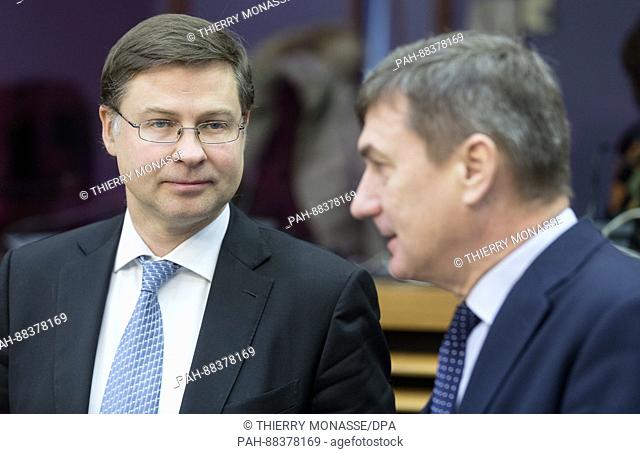 February 22, 2017 - Brussels, Belgium: EU Euro & Social Dialogue Commissioner Valdis Dombrovskis (L) is talking with the EU Digital Single Market Commissioner...