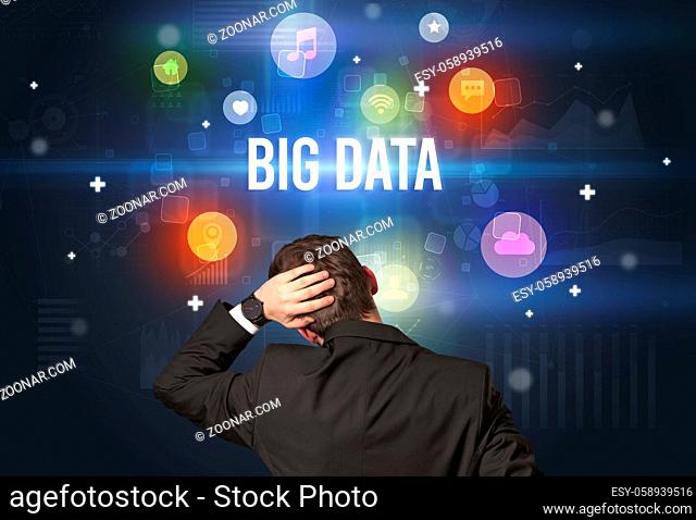 Rear view of a businessman with BIG DATA inscription, modern technology concept