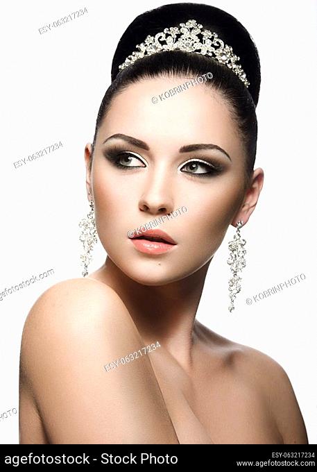 Portrait of a beautiful woman in the image of the bride . Picture taken in the studio on a black background