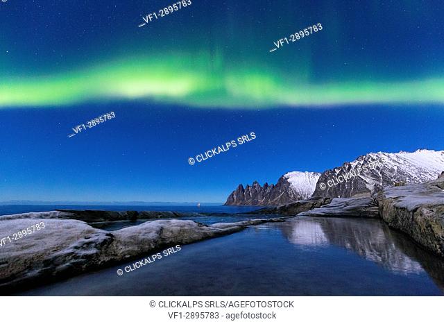 Northern lights above the bay facing Tungeneset. Tungeneset, Ersfjorden, Senja, Norway, Europe