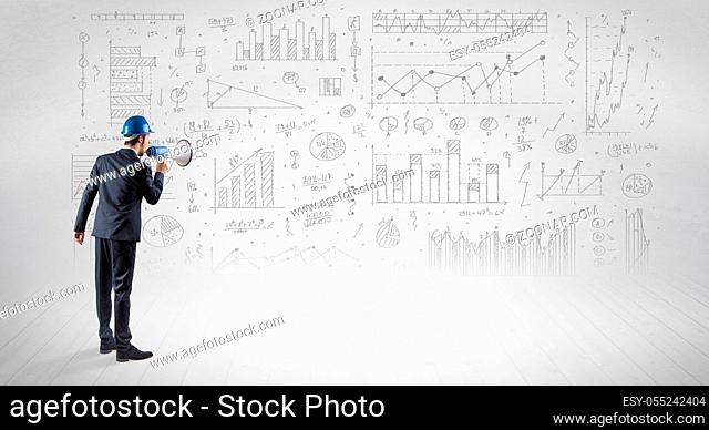 Engineer with construction helmet holding a plan and standing with graphs, charts and reports on the background