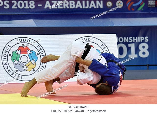 Czech judoka Pavel Petrikov (in blue) competes during the match against Daniel Cargnin from Brazil during eight-final round of men's 66kg class in World Judo...