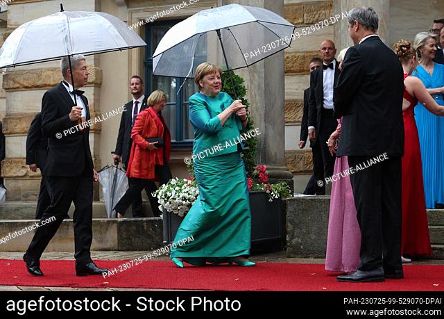 25 July 2023, Bavaria, Bayreuth: Former German Chancellor Angela Merkel (CDU) and husband Joachim Sauer come to the opening of the Richard Wagner Festival with...