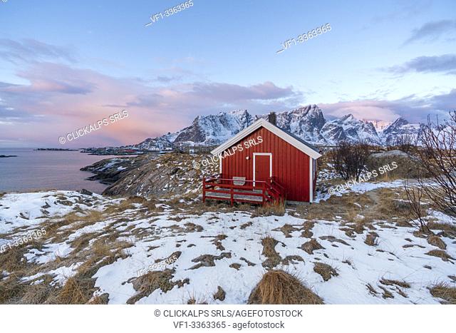 Traditional fishermen house in winter at dawn. Hamnoy, Nordland county, Northern Norway, Norway