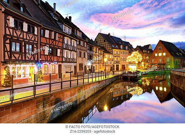Christmas decoration by night at the Little Venice. Colmar. Wine route. Haut-Rhin. Alsace. France