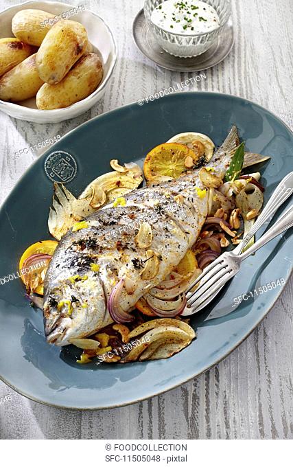 Seabream on a fennel medley with new potatoes and a herb sauce