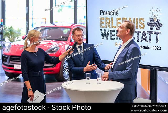 04 September 2023, Saxony, Leipzig: Kristin Bergemann (Porsche Leipzig) interviews Michael Kretschmer (M, CDU), Prime Minister of Saxony