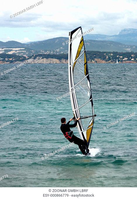 Suited windsurfer