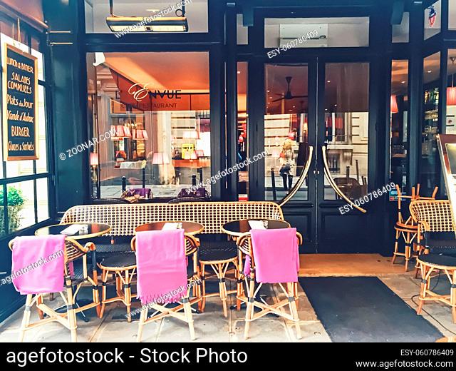 Paris, France circa January, 2020: Parisian cafe and restaurant on central street of Paris, France