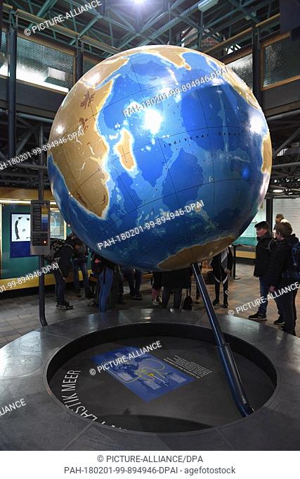 A large globe is placed at the entrance of the German Oceanographic Museum in Stralsund, Germany, 1 February 2018. Visitors of the German Oceanographic Museum...