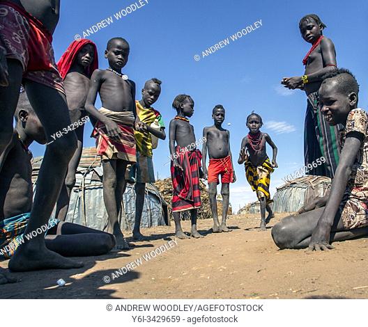 Dassenach children play marbles near Omorate Ethiopia
