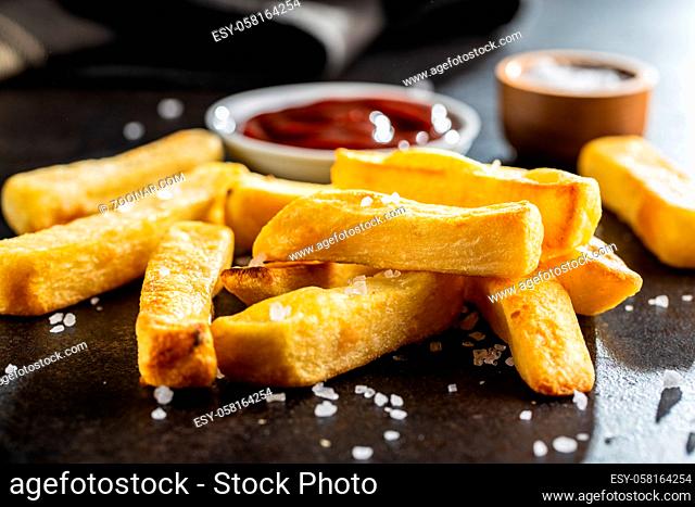 Big french fries. Fried potato chips with ketcheup