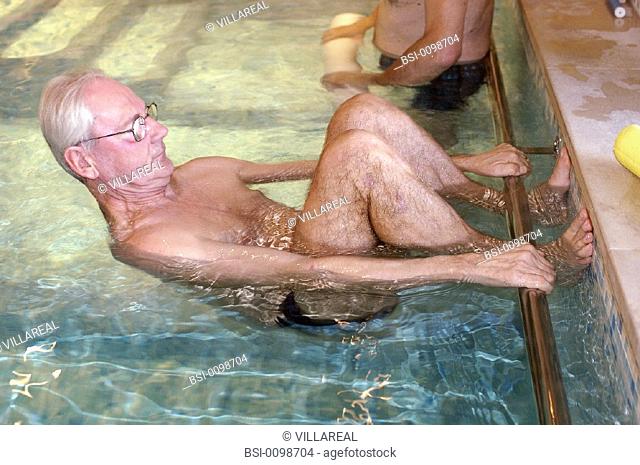 REHABILITATION, ELDERLY PERSON<BR>Photo essay.<BR>Therapy pool at Dinan, in the Britanny region of France.   The sensation of weightlessness is the large...