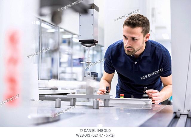 Man operating machine in testing instrument room