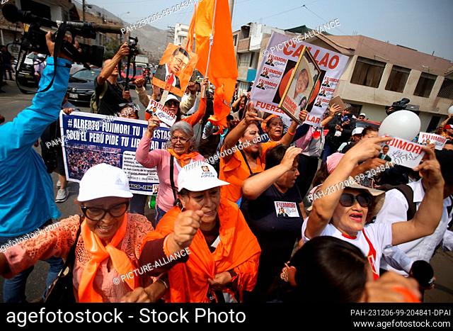 06 December 2023, Peru, Lima: Supporters of former Peruvian President Fujimori wait outside the Bordillos prison for his release