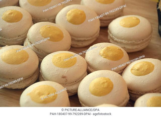 06 April 2018, US, New York: Fried egg macarons photographed during a preview in the ""Egg house"". Fried egg lollipops, a carton of eggs for cuddling and a...