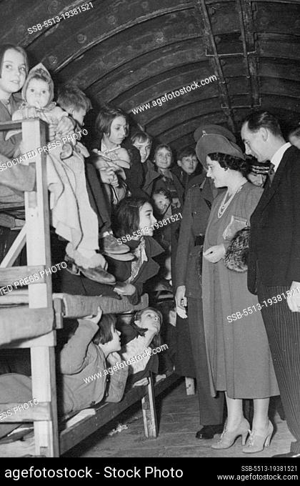 King and Queen Inspect Bunks in London Air and Shelter - The Queen, with the King, behind Her Majesty inspecting bunks in one of the deep air raid shelters...