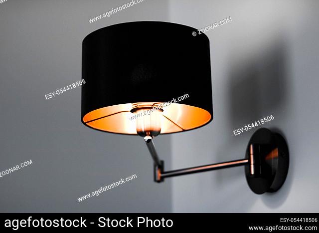 Interior design, indoor lamps and electricity concept - Bronze lamp in a room, elegant modern home decor lighting