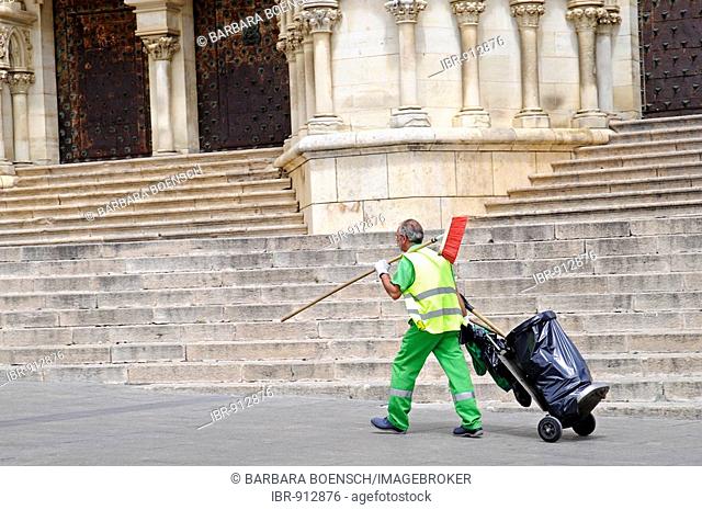 Street sweeper with a broom and a garbage can, historic town centre, Cuenca, Castile-La Mancha, Spain, Europe
