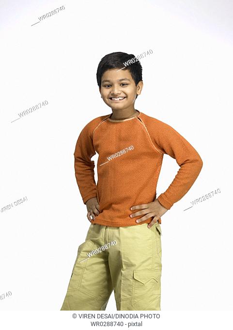 South Asian Indian boy looking at camera in nursery school MR