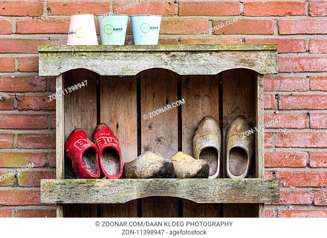 Giethoorn, The Netherlands - November 11, 2016: Three pair of wooden shoes in the small town of Giethoorn, Overijssel