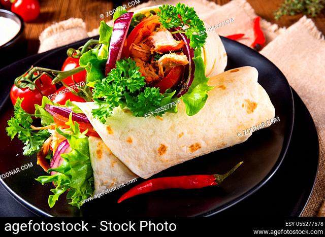 Tasty wraps filled with pulled pork and salad