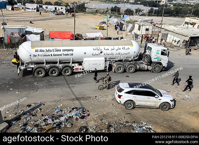 18 December 2023, Palestinian Territories, Rafah: Aid trucks enter Gaza through the Kerem Shalom commercial crossing. Israel opened the Kerem Shalom border...