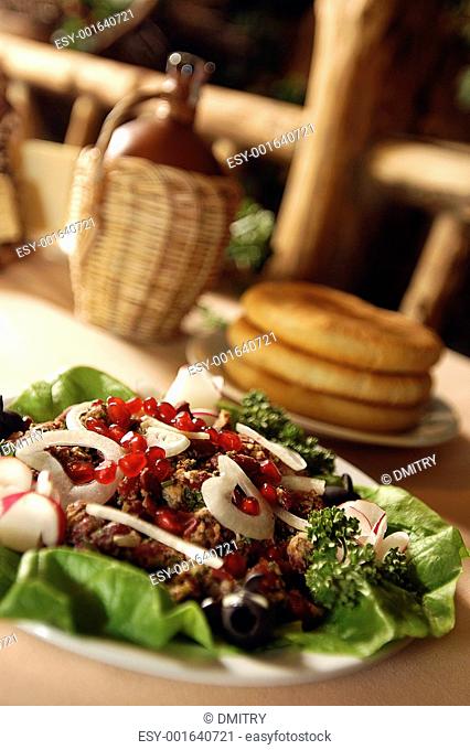 peaces of fried meat with wine and unleavened wheat cake, geor