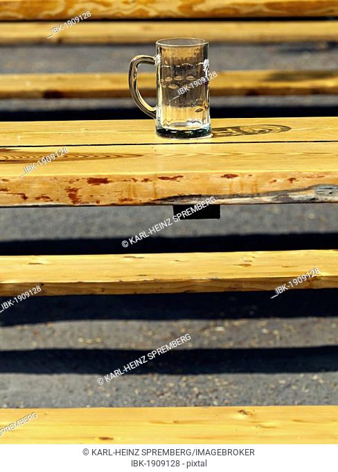 Empty beer mug on a table in a beer garden