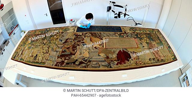 Laura Petzold, textile conservator of the Classics Foundation Weimar, works with concentration on a Reformation carpet of the Flemish active master Seger...