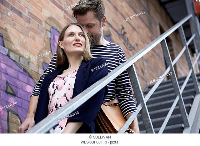 Couple on stairs outdoors