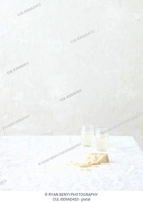 Still life with parmesan and white wine