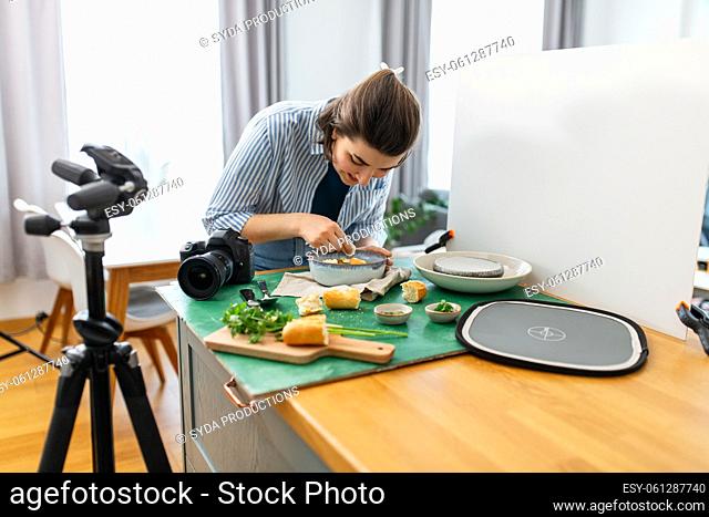 food photographer arranging composition in kitchen