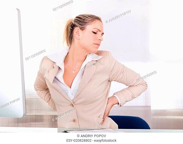 Young Businesswoman Suffering From Back Pain