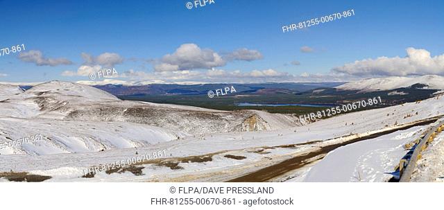 View across snow covered mountain, looking towards Loch Morlich with Aviemore and Monadhliath Mountains in distance, Cairn Gorm, Cairngorms N.P