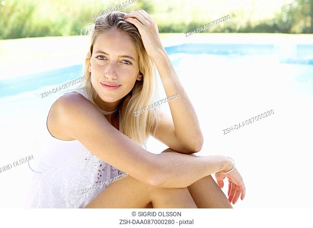 Woman at poolside, portrait